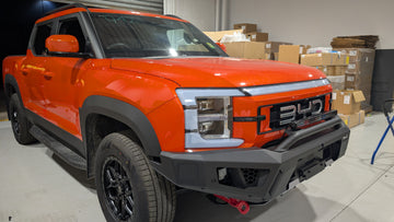 Orange BYD Shark 6 truck