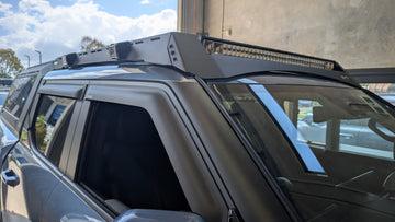 Car with a roof rack and LED light bar