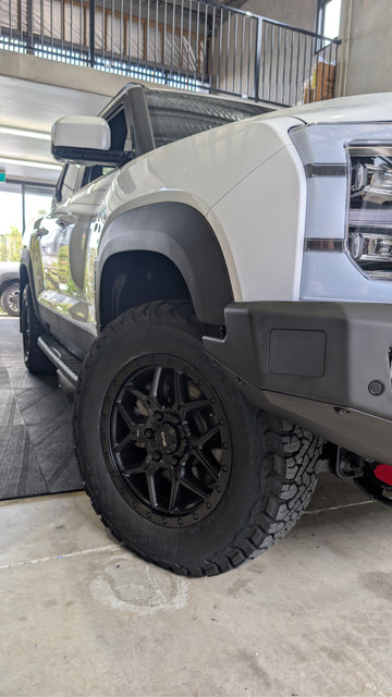White truck with black wheels